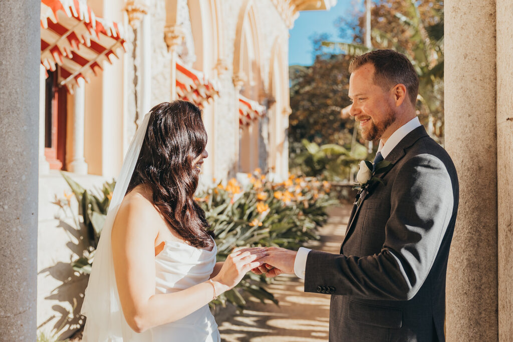 Bride and groom exchanging rings at wedding ceremony
